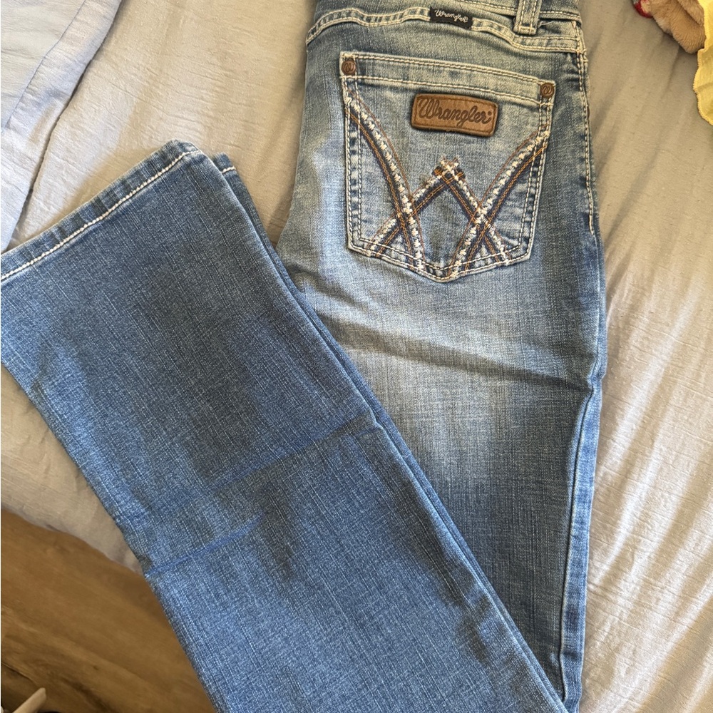 Wrangler Blue Boot Cut Jeans with Distressed Finish